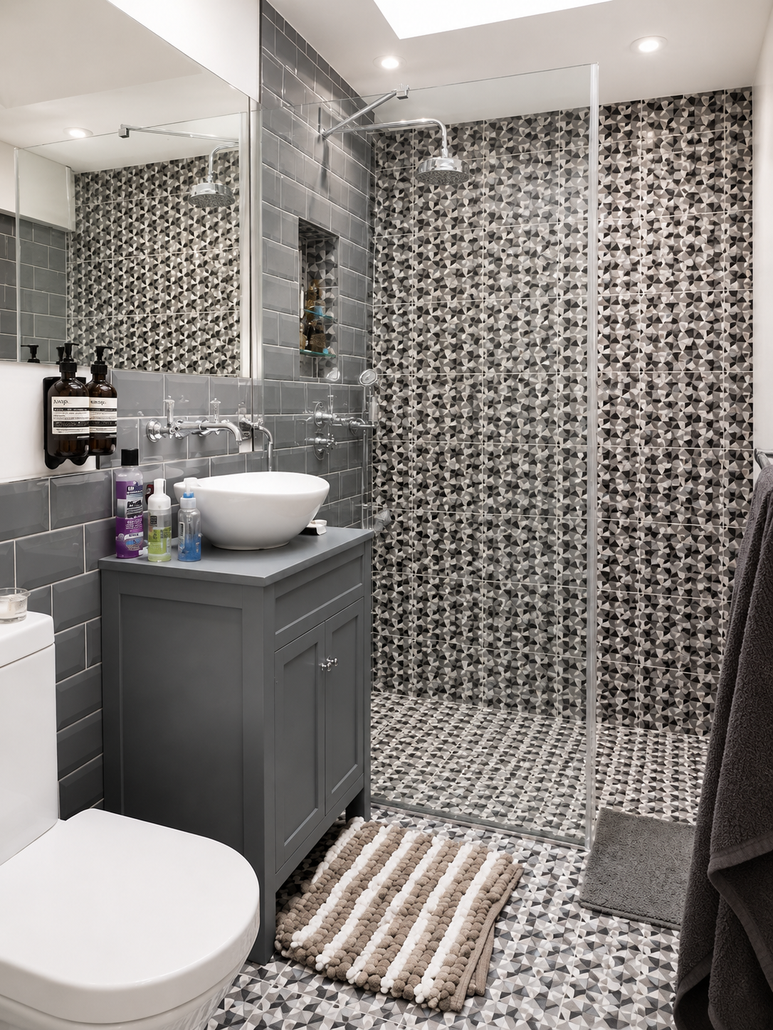 Contemporary shower room with geometric monochrome tiles, grey vanity and vessel basin